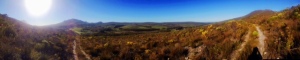 From halfway up the mountain, a panorama of the valley and rolling hills below in Hermanus, SA at Volmoed Retreat Center 